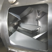 The rotating drum has internal mixing flights that provide a four-way mixing action